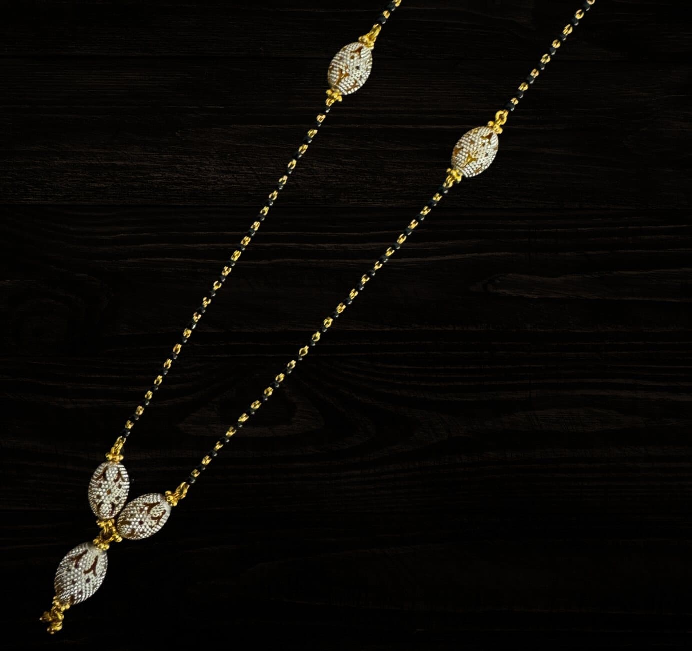 A fine 22ct mangalsutra with white-gold filigree beads