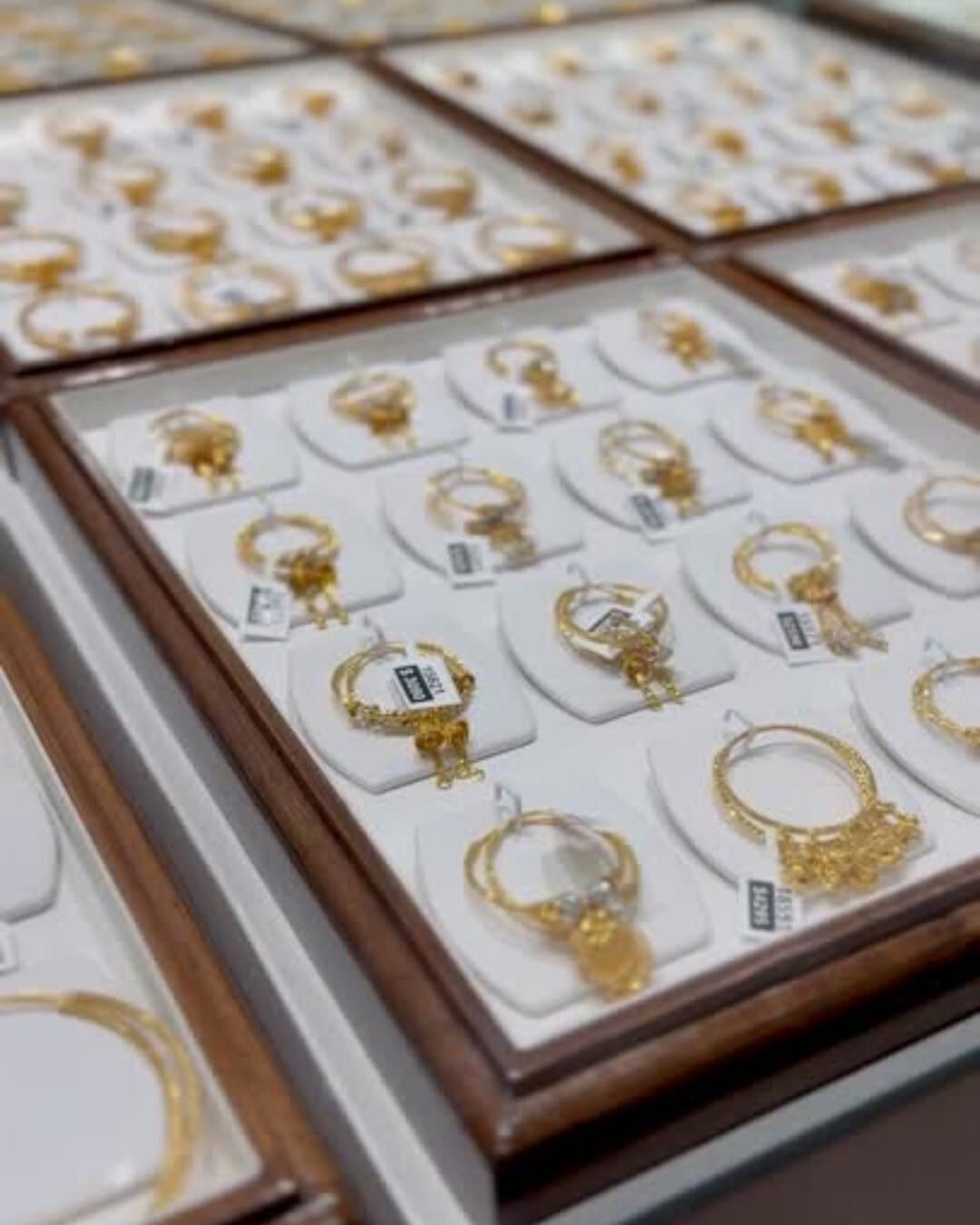 Trays of 22ct gold jewellery in the display case at Shreeji Jewellers